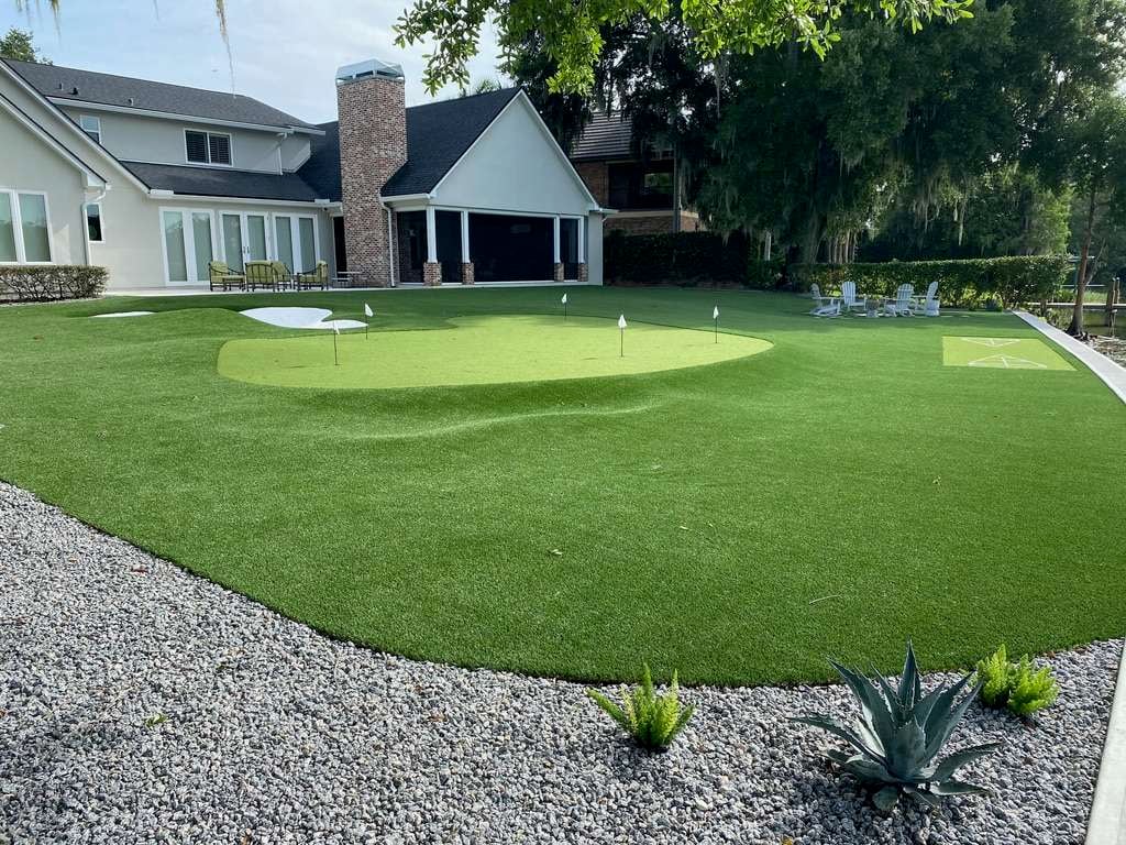 A house with an artificial turf putting green golf course