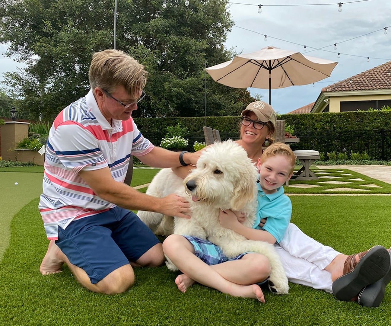 dog & family on turf