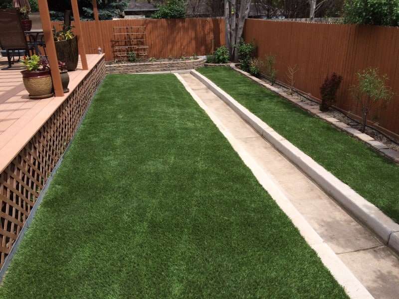 artificial grass next to patio in yard