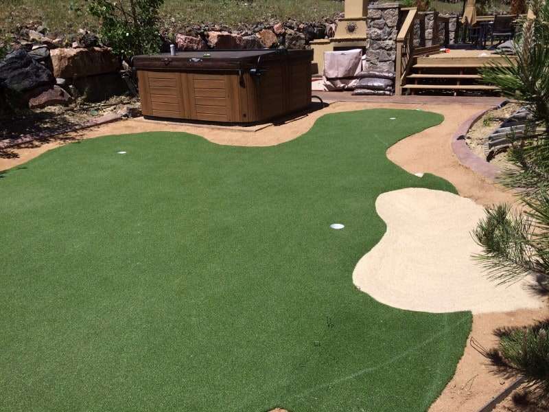 Putting green next to pool