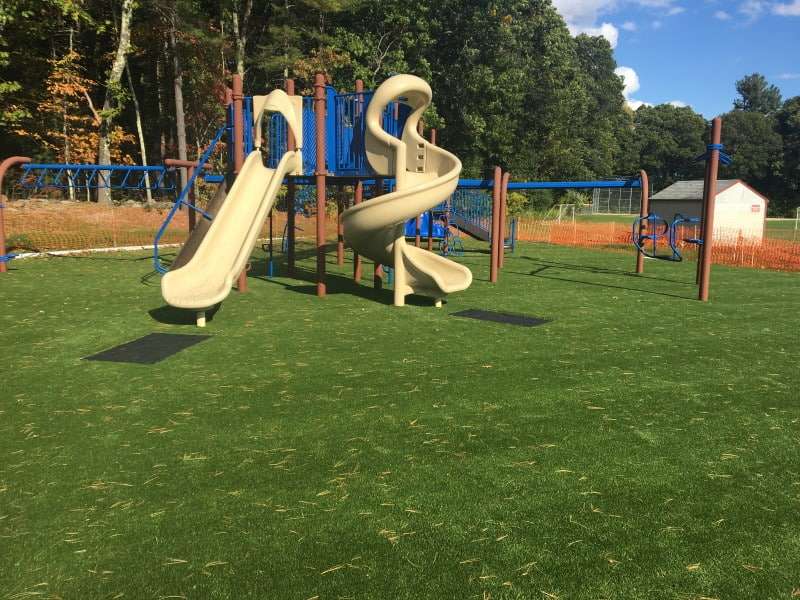 Spofford School slide on artificial grass