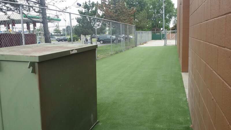 Dirt Paws fenced in artificial turf installation