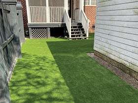 Low maintenance artificial grass yard