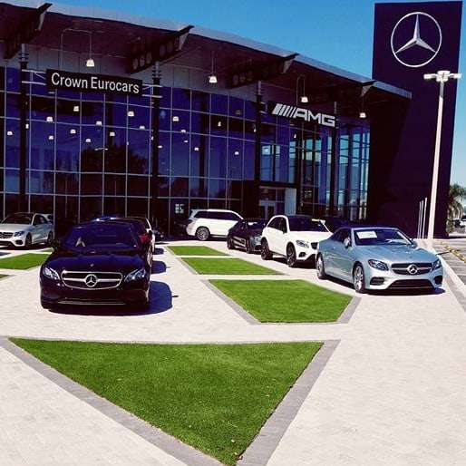 commercial artificial grass installation at a mercedes dealership