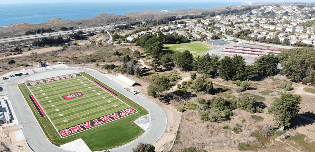 An aerial view of seaside high school artificial turf football field