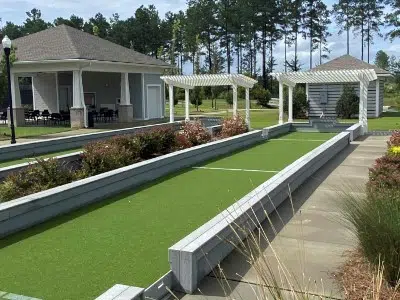 A long shot of a bocce ball court made out of artificial turf